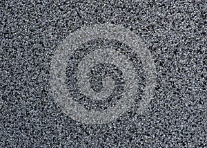 Grey and black fragments of pavement, texture. Background with copy space