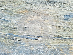 Grey blue stone wall background texture. Rocky formation. Greek island Cyclades Greece