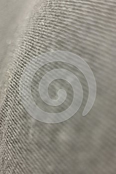 grey blurred abstract textured fabric background.