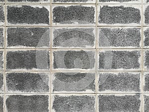 Gris ladrillo bloquear muro mostrar patrón pila bloquear bruto superficie textura soldar articulaciones mortero 