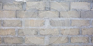 Grey brick cinderblocks wall closeup texture concrete block background photo