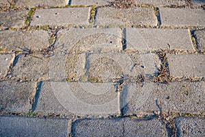 Grey brick pavement background close up. Gray stone tile block background