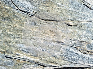 Grey brown stone wall background texture. Rocky formation. Greek island Cyclades Greece