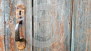 Grey and brown Wooden Door Planking Texture with vintage door handle