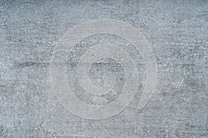 A grey bumpy concrete wall texture photo