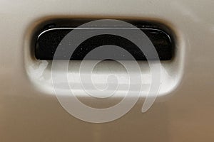 Grey car door handle