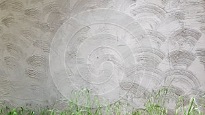 Grey cement wall plastering with circle geometric wave pattern