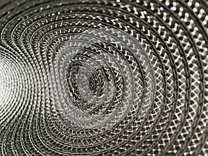 Grey colour background from circular wicker pattern texture.