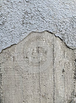 Grey concrete wall with a breakaway paint