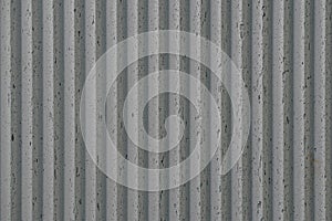 grey concrete wall with deep textured 3d lines vertical