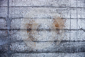 Grey concrete wall with hardened traces of the shuttering moulds