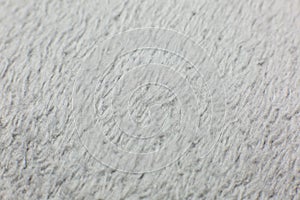Grey cotton towel or carpet.fluffy texture background. Close up, macro photo. Soft focus image