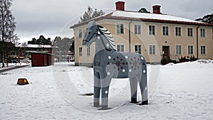 Grey Dalarna horse in Rattvik in winter in Sweden