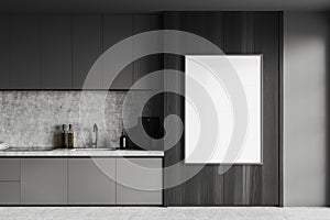 Grey and dark wooden kitchen with counters and poster