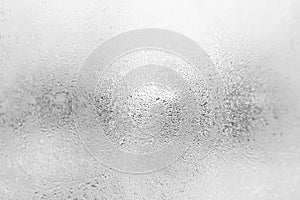 Grey dew drops on the glas