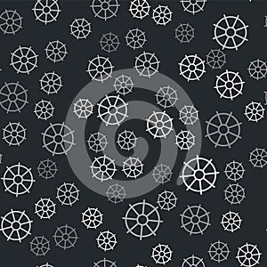 Grey Dharma wheel icon isolated seamless pattern on black background. Buddhism religion sign. Dharmachakra symbol