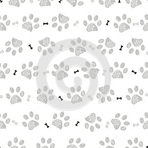 Grey doodle paw prints with bones pattern. Seamless fabric design pattern