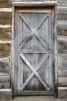 Grey Door in Log Cabin Wall