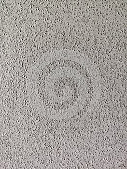 Grey embossed plastic surface. Abstract background or texture.