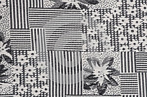 Grey fabric background with flower pattern close-up