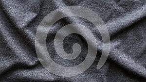 Grey fabric cloth with folds background and texture