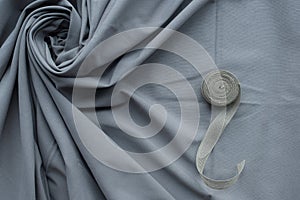 Grey fabric with cloth roll background