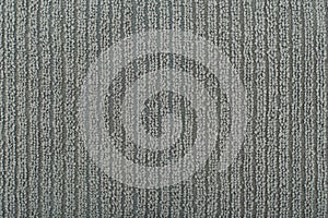 Grey flossy towel texture close up. Fluffy fabric with vertical stripes. photo