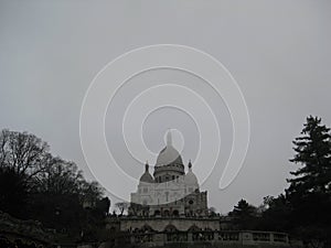 A grey foggy day view up to the SacrÃÂ©-CÃâur, Paris photo