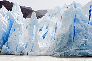 Grey Glacier, scarp of Grey Glacier, colorful blue ice on spiky escarpment, Lago Grey, Chile