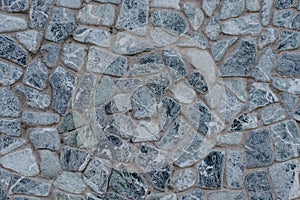 Grey gray detailed stone close up beautiful with concrete wall stone texture of modern house. White and black blue hue color. Grey