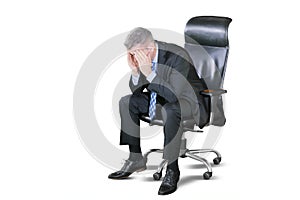 Grey hair man feeling frustration on the chair