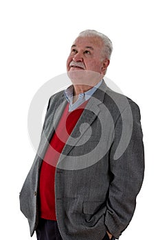 Grey-haired elderly man standing thinking