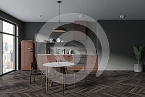 Grey home kitchen interior with eating table and seats, panoramic window