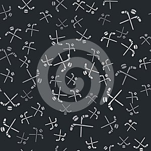 Grey Ice hockey sticks and puck icon isolated seamless pattern on black background. Game start. Vector