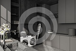 Grey interior of laundry room with washing machine and iron table