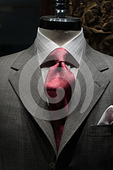 Grey jacket with red tie