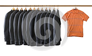 Grey jackets and orange t shirt hanged