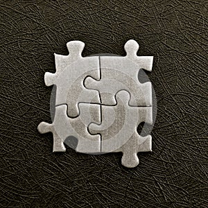 Grey jigsaw pieces on a black background