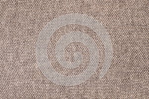 Grey knitted fabric texture as background. Beautiful pattern