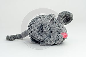 Grey knitted mouse on a white background