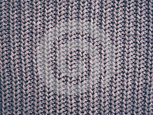 Grey knitted texture, dark fabric background. Vinrage color , trends fashion. Woolen sweater, backdrop clothing