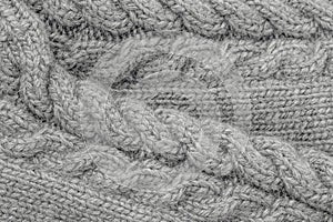 Grey Knitwear Fabric Texture with Pigtails closeup