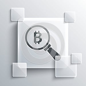 Grey Magnifying glass with Bitcoin icon isolated on grey background. Physical bit coin. Blockchain based secure crypto photo