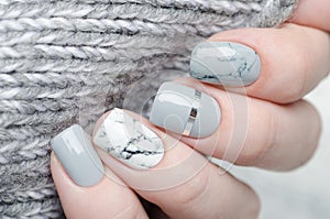 Grey manicure with marble print and silver details