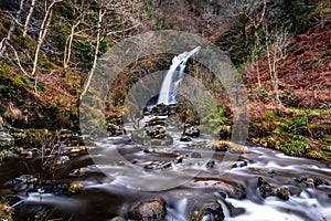 Grey Mare`s Tail Waterfall and burn in winter, Galloway Forest Park, Scotland photo