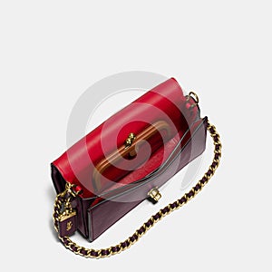 Grey and maroon small handbag with white background, Elegant maroon leather sling bag with golden chain and black sling with white