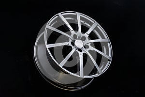 Grey Matt caluminum alloy wheel disc on black background. Sports a lot of spokes