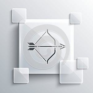 Grey Medieval bow and arrow icon isolated on grey background. Medieval weapon. Square glass panels. Vector