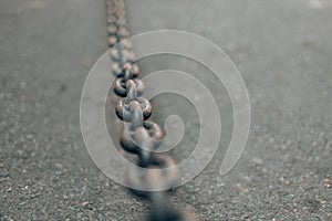 Grey metal chain on background