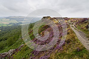 Grey, misty summer day along the top of Curbar Edge in the Derbyshire Peak District